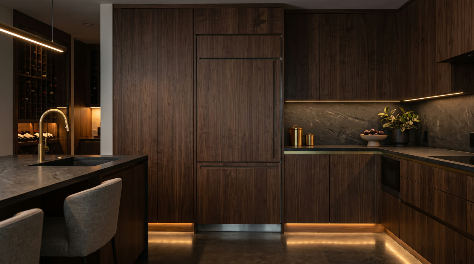 Integrated Thermador refrigeration beside a glass wine room